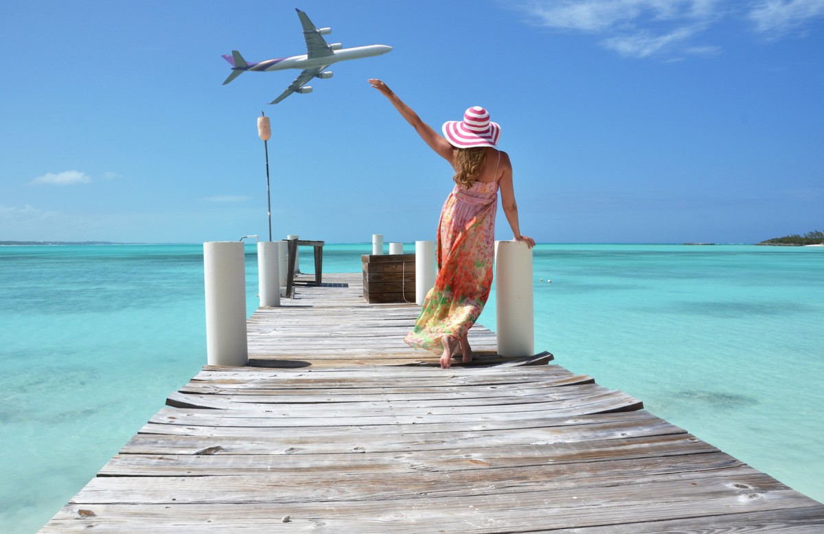 Girl on the wooden jetty. Exuma, Bahamas